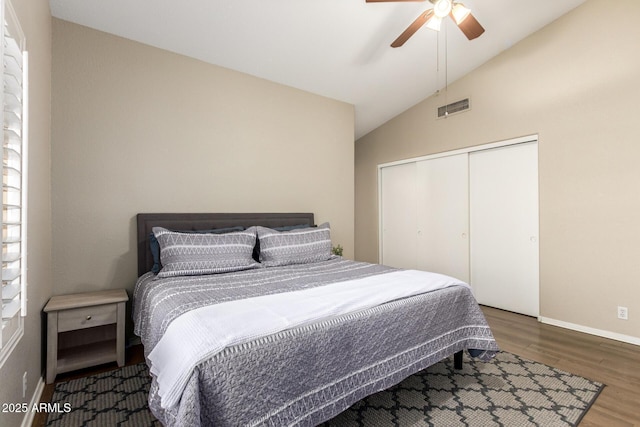 bedroom featuring a closet, vaulted ceiling, ceiling fan, and dark hardwood / wood-style floors