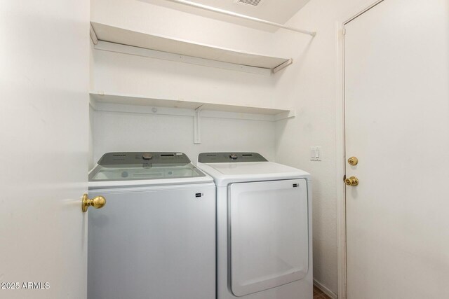 laundry area featuring washing machine and dryer