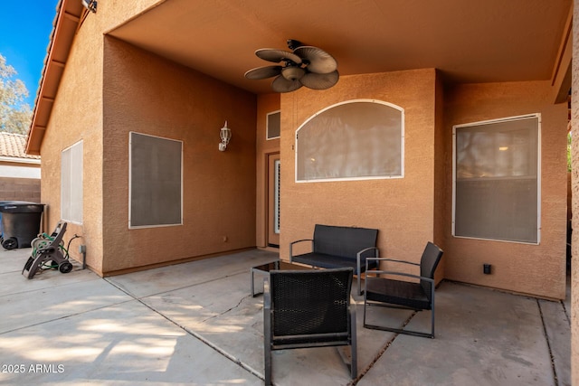 view of patio with outdoor lounge area and ceiling fan