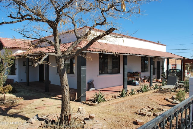 rear view of house with a patio