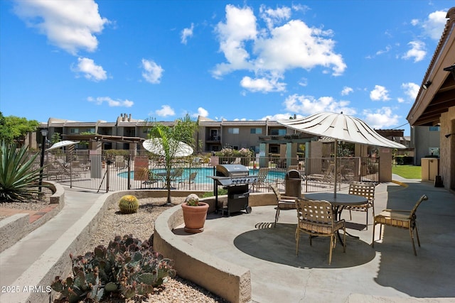 7430 E Chaparral Rd Unit A222, Scottsdale, AZ 85250 - view of patio with a community pool and area for grilling
