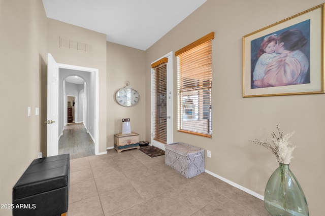 foyer entrance featuring light tile patterned flooring