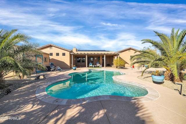 view of swimming pool with a patio area