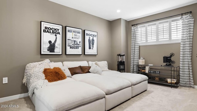 living area featuring recessed lighting, baseboards, and carpet floors