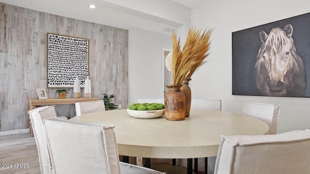 dining area with wood finished floors and recessed lighting