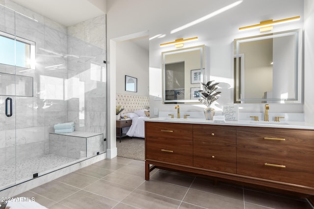 bathroom featuring an enclosed shower, vanity, and tile patterned flooring