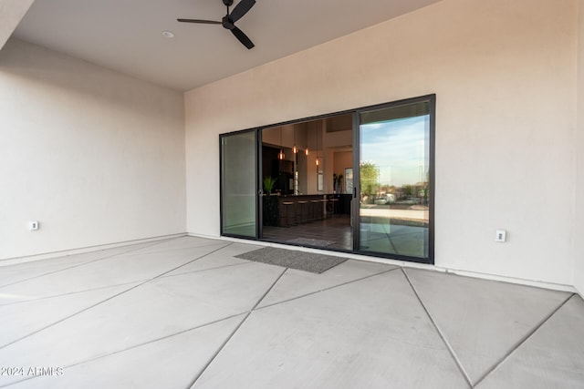 view of patio with ceiling fan