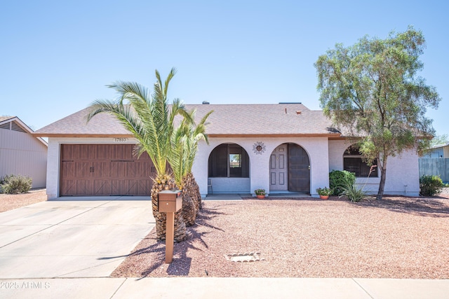 17810 N 34th Pl, Phoenix, AZ 85032 - mediterranean / spanish-style house featuring a garage, driveway, stucco siding, and covered porch
