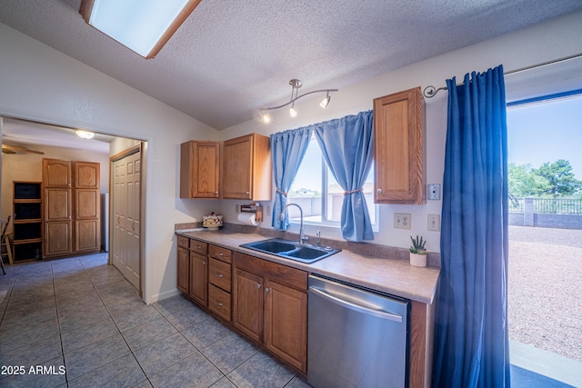 17810 N 34th Pl, Phoenix, AZ 85032 - kitchen with stainless steel dishwasher, a textured ceiling, light countertops, vaulted ceiling, and tile patterned flooring