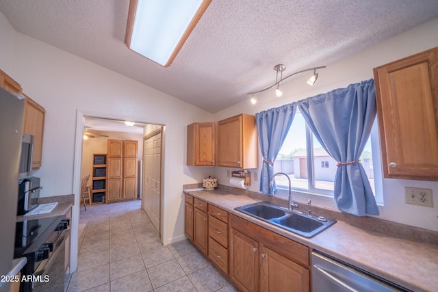 17810 N 34th Pl, Phoenix, AZ 85032 - kitchen with a textured ceiling, dishwashing machine, vaulted ceiling, oven, and light tile patterned flooring