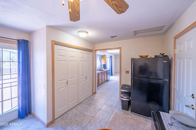 17810 N 34th Pl, Phoenix, AZ 85032 - kitchen featuring freestanding refrigerator, light tile patterned floors, and a textured ceiling