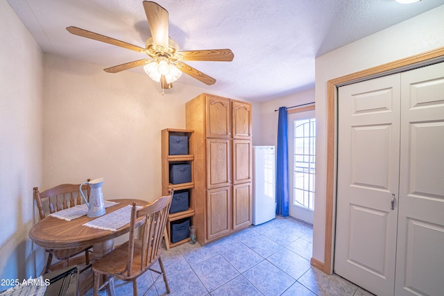 17810 N 34th Pl, Phoenix, AZ 85032 - dining area with light tile patterned floors, ceiling fan, and a textured ceiling