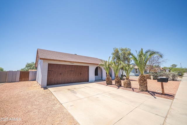 17810 N 34th Pl, Phoenix, AZ 85032 - view of front of house featuring driveway, an attached garage, and stucco siding