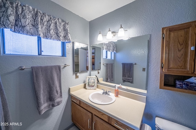 17810 N 34th Pl, Phoenix, AZ 85032 - bathroom with a textured wall, plenty of natural light, and vanity