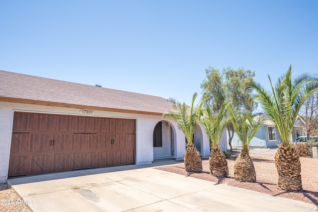 17810 N 34th Pl, Phoenix, AZ 85032 - view of front of house with driveway, stucco siding, and an attached garage