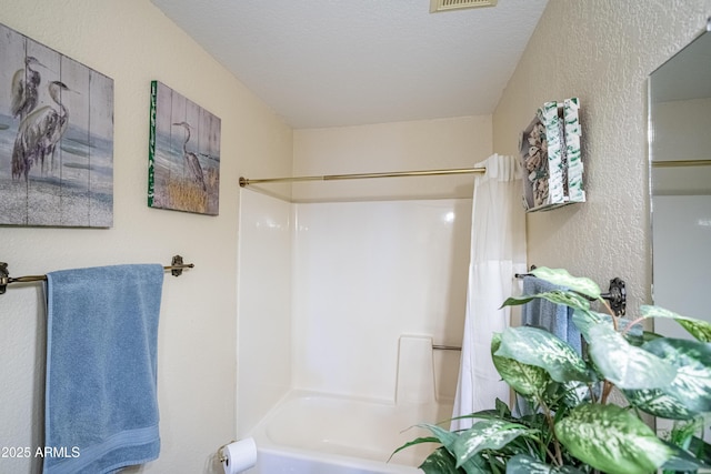 17810 N 34th Pl, Phoenix, AZ 85032 - bathroom featuring shower / bath combo and a textured wall