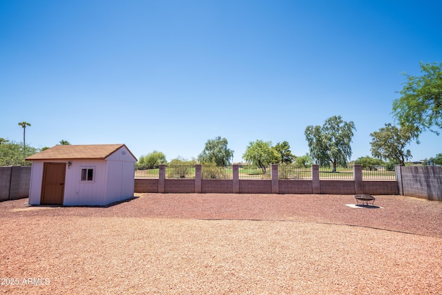 17810 N 34th Pl, Phoenix, AZ 85032 - fenced backyard with a storage unit and a fire pit