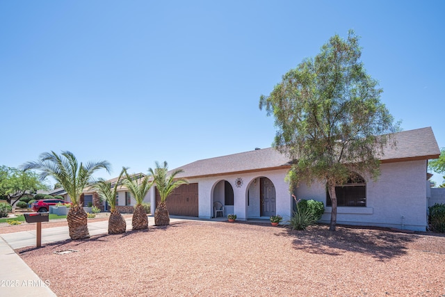 17810 N 34th Pl, Phoenix, AZ 85032 - view of front of house featuring a garage, driveway, and stucco siding