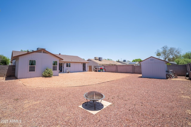 17810 N 34th Pl, Phoenix, AZ 85032 - back of property featuring a shed, a fire pit, and a fenced backyard