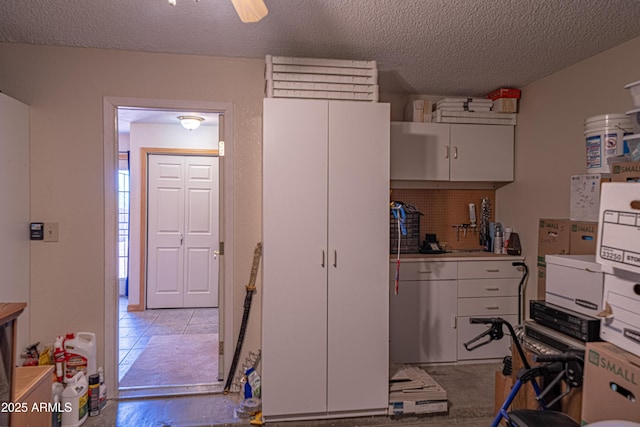 17810 N 34th Pl, Phoenix, AZ 85032 - kitchen with a textured ceiling and white cabinetry
