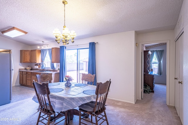 17810 N 34th Pl, Phoenix, AZ 85032 - dining space with a textured ceiling, a chandelier, and light colored carpet