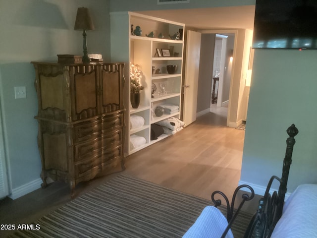 1036 E Wagon Wheel Dr, Phoenix, AZ 85020 - bedroom featuring baseboards and wood finished floors