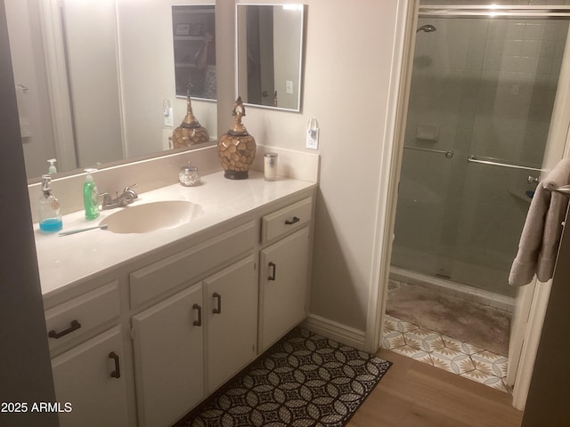 1036 E Wagon Wheel Dr, Phoenix, AZ 85020 - bathroom with vanity, a stall shower, and wood finished floors