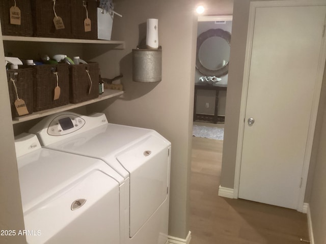 1036 E Wagon Wheel Dr, Phoenix, AZ 85020 - laundry area featuring washing machine and clothes dryer and wood finished floors