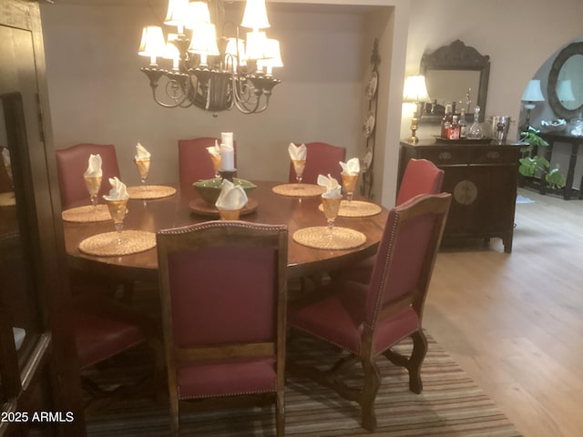 1036 E Wagon Wheel Dr, Phoenix, AZ 85020 - dining room featuring wood finished floors and a chandelier