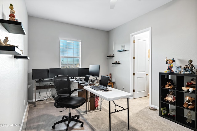 carpeted office with baseboards