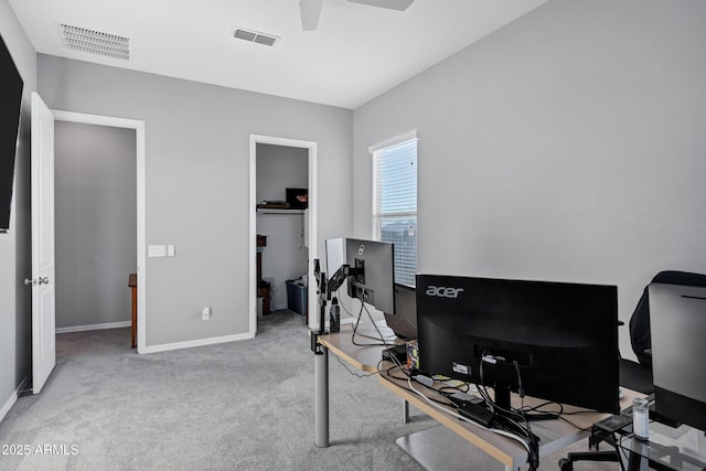 office area featuring carpet, visible vents, ceiling fan, and baseboards