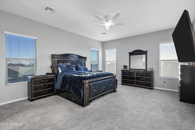 bedroom with carpet, visible vents, and baseboards