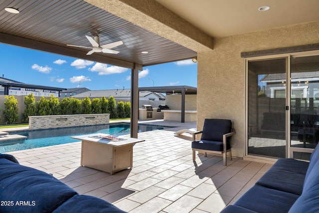 view of patio with a fenced in pool, area for grilling, a ceiling fan, fence, and a fire pit