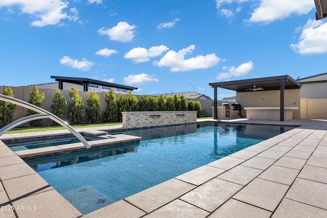 view of pool featuring a patio area, fence, an outdoor kitchen, and a fenced in pool