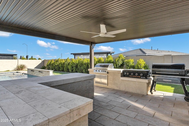 view of patio / terrace featuring a fenced backyard, grilling area, a ceiling fan, and area for grilling