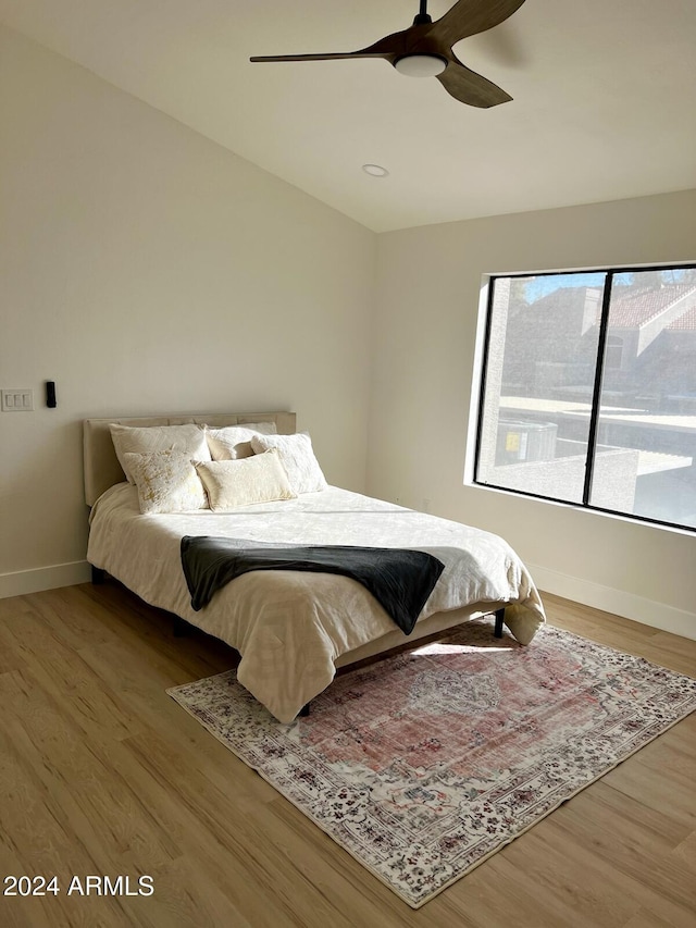 bedroom featuring light hardwood / wood-style flooring and ceiling fan