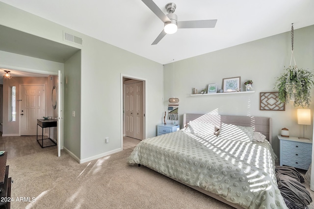 bedroom featuring carpet floors, a closet, and ceiling fan