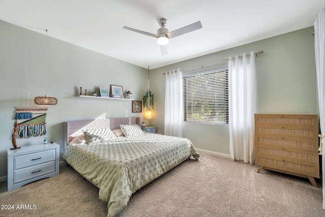 bedroom with ceiling fan and carpet flooring