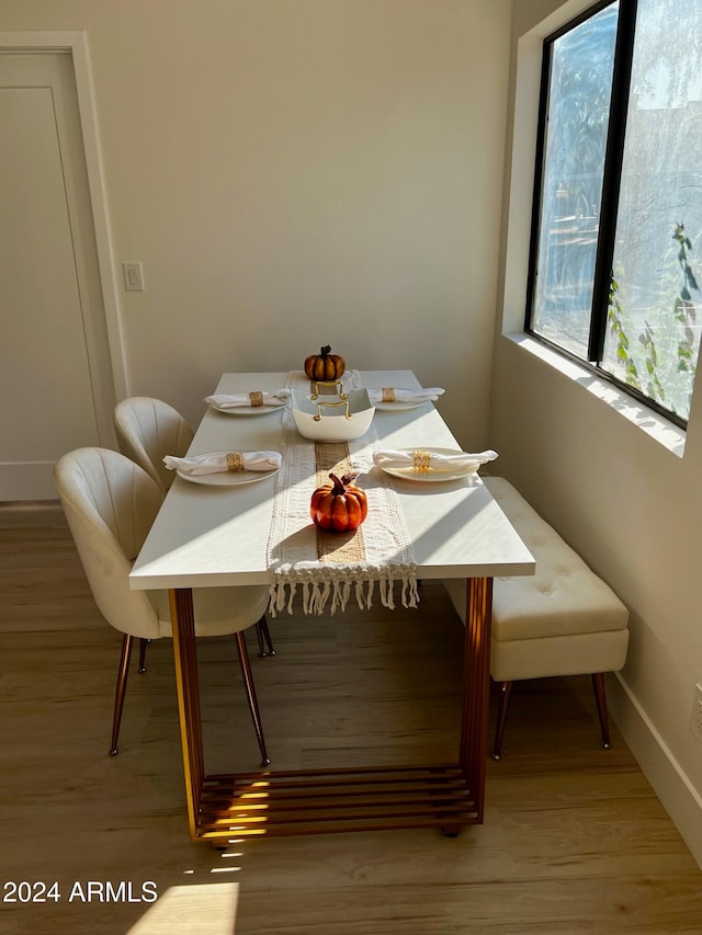 dining space featuring light wood-type flooring