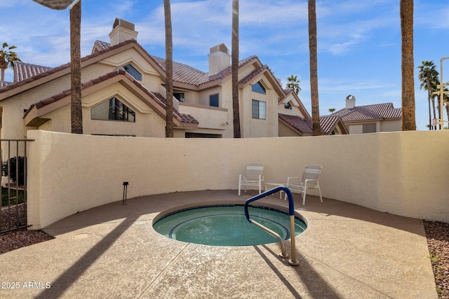 view of pool with a community hot tub and a patio