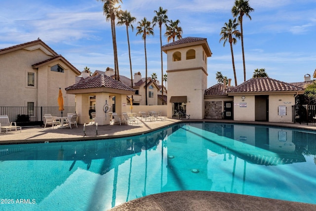 view of swimming pool featuring a patio area