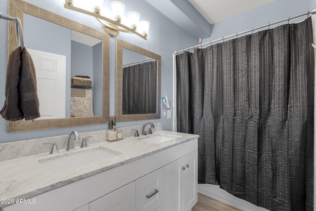 bathroom featuring vanity and hardwood / wood-style floors