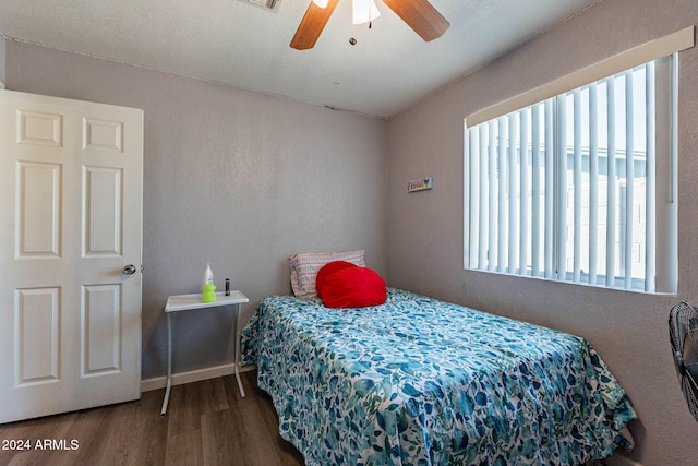 bedroom with hardwood / wood-style floors and ceiling fan