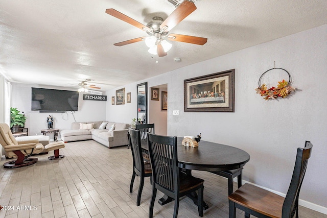 dining area featuring ceiling fan, a textured ceiling, and hardwood / wood-style floors