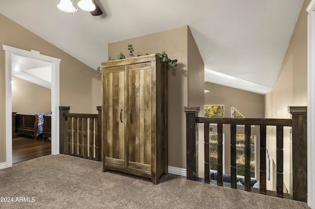 interior space featuring carpet and vaulted ceiling