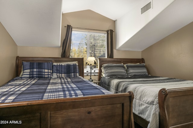 bedroom featuring lofted ceiling