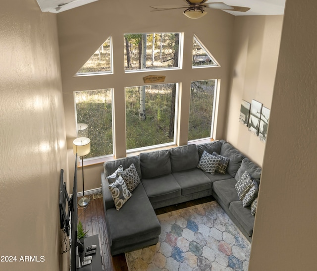 living room with wood-type flooring, plenty of natural light, and ceiling fan