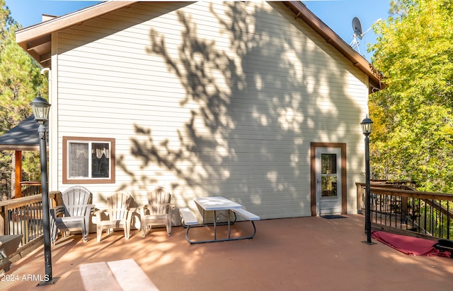 rear view of property with a deck