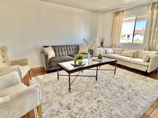 living area featuring baseboards