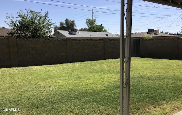 view of yard with a fenced backyard